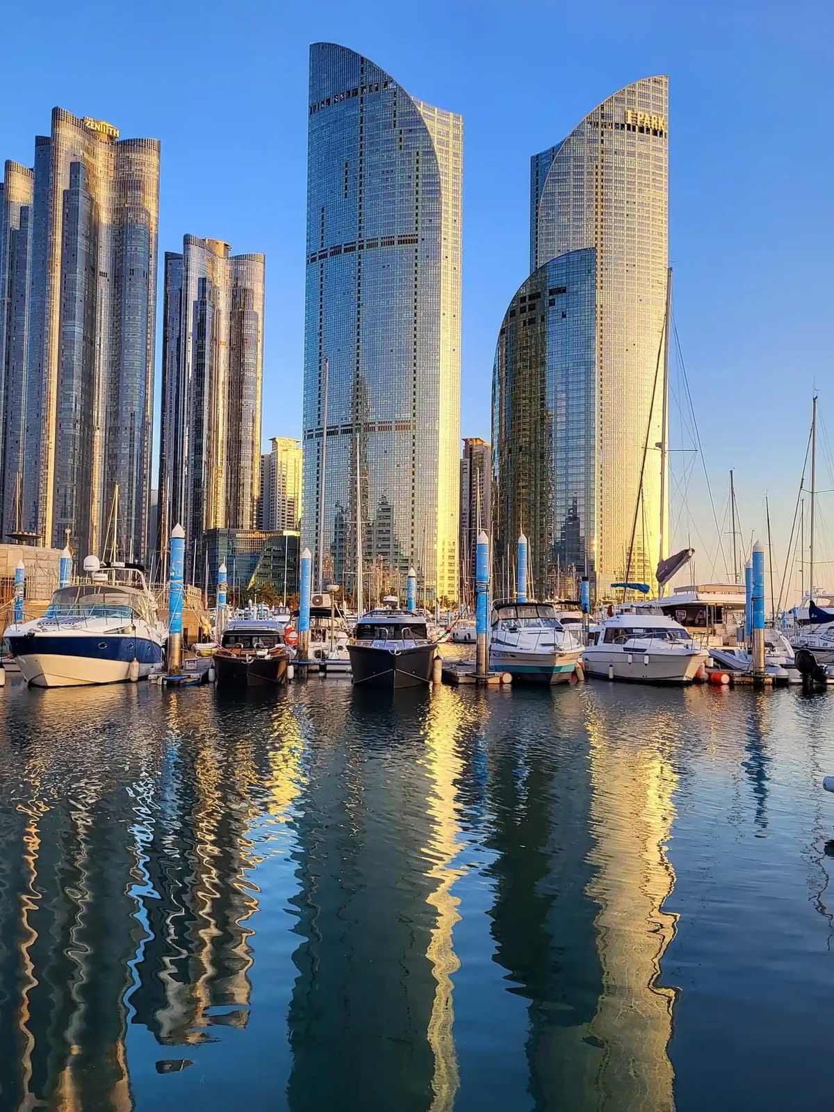 Luxury high-rise towers of Marine City and yachts anchored in Haeundae Busan