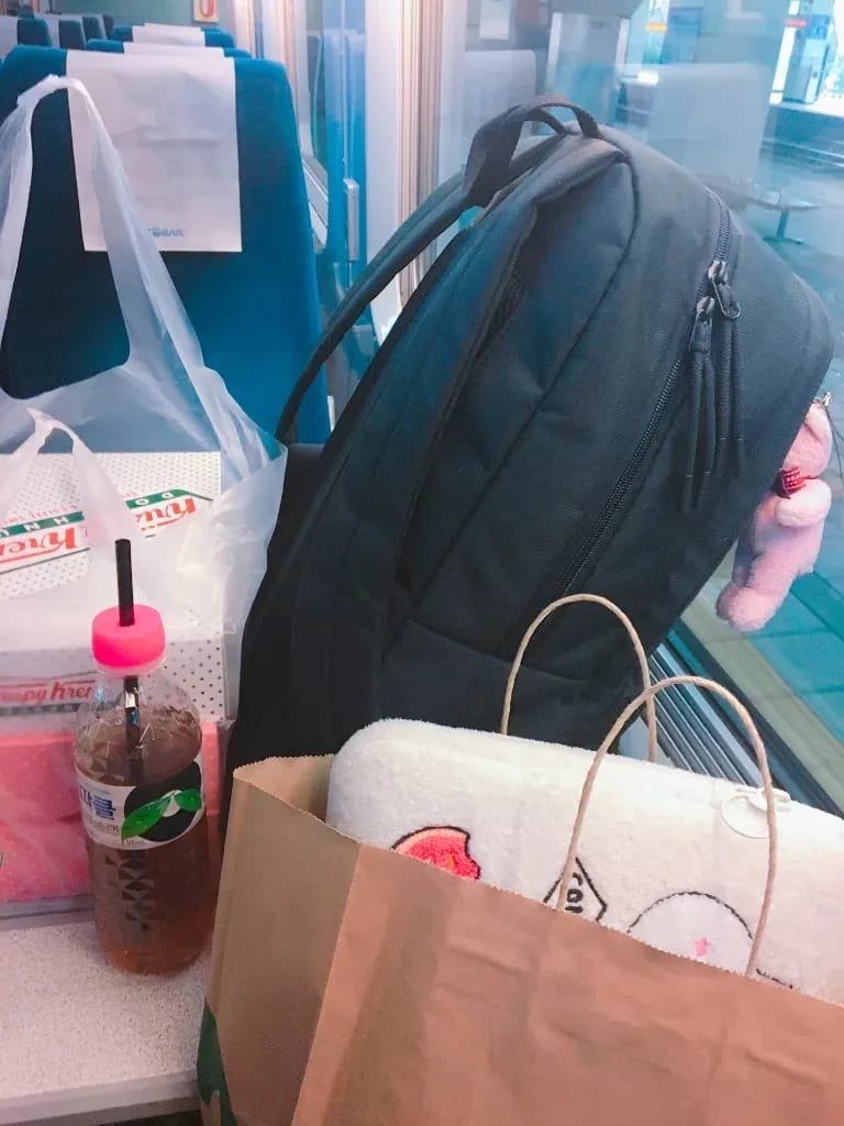 KORAIL train passenger seat with snacks and drinks for a KTX bullet train guide