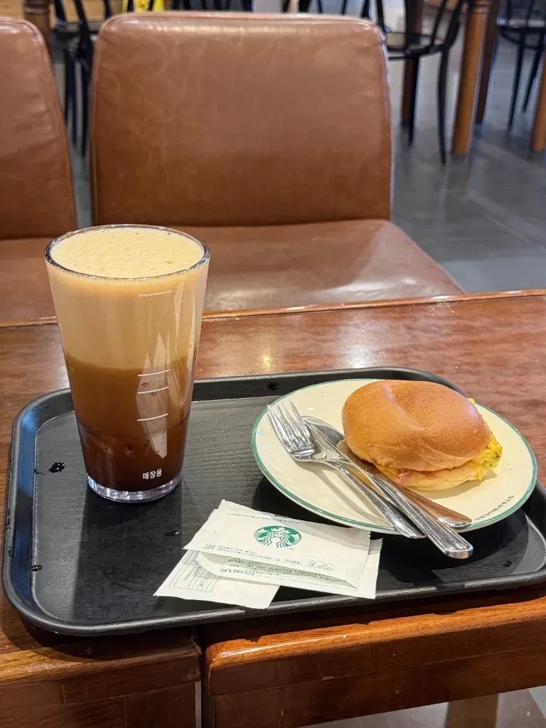 Reusable glass cup labeled for in-store use at a Korean cafe