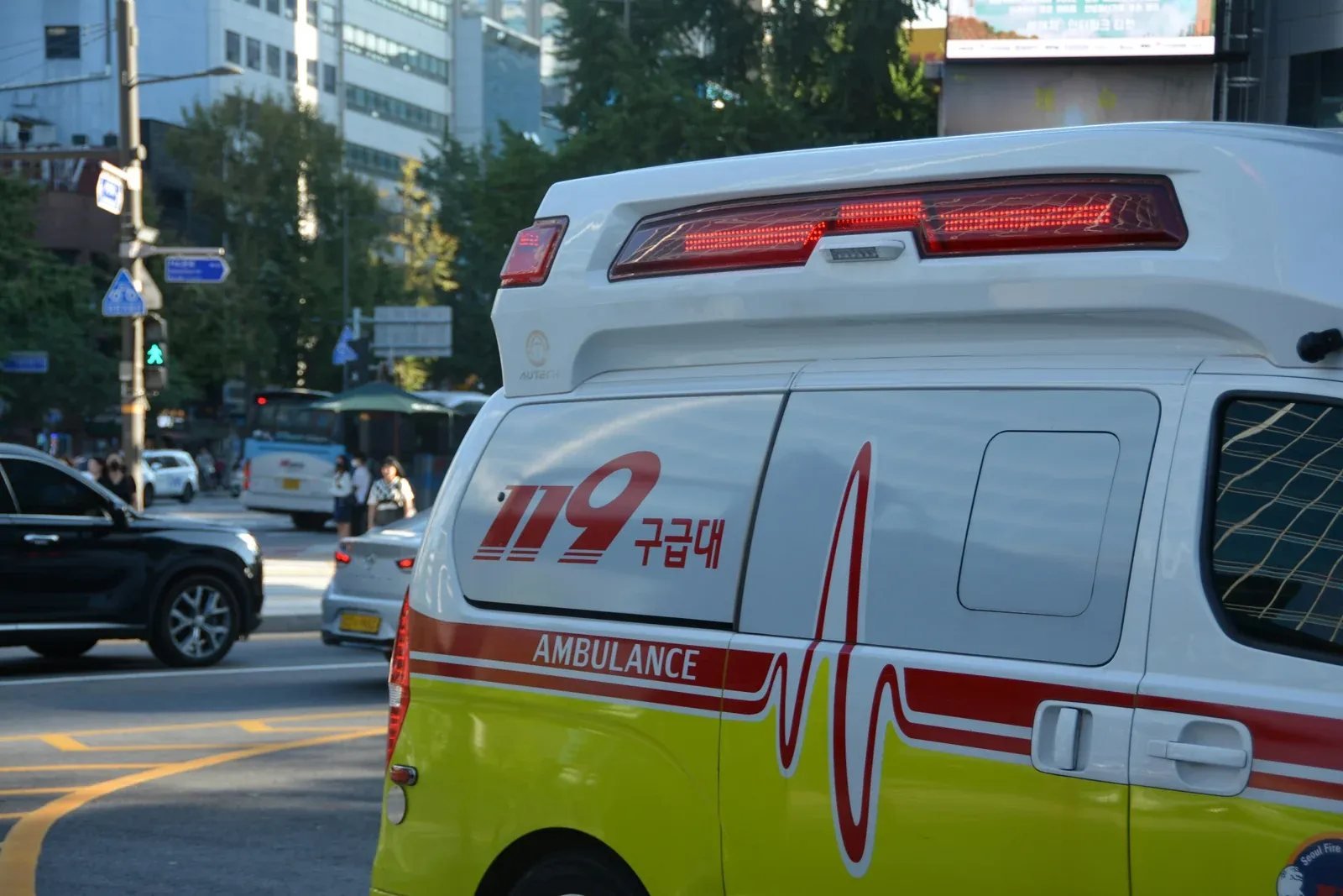 Side view of a Korean 119 emergency ambulance on a Seoul city street