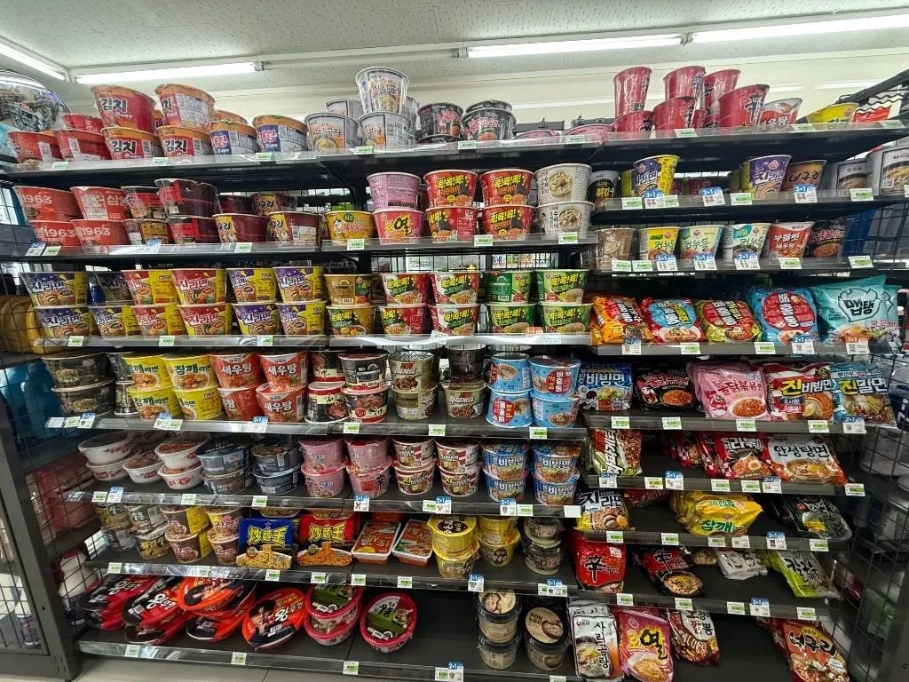 Selection of Korean instant cup ramen on convenience store shelves