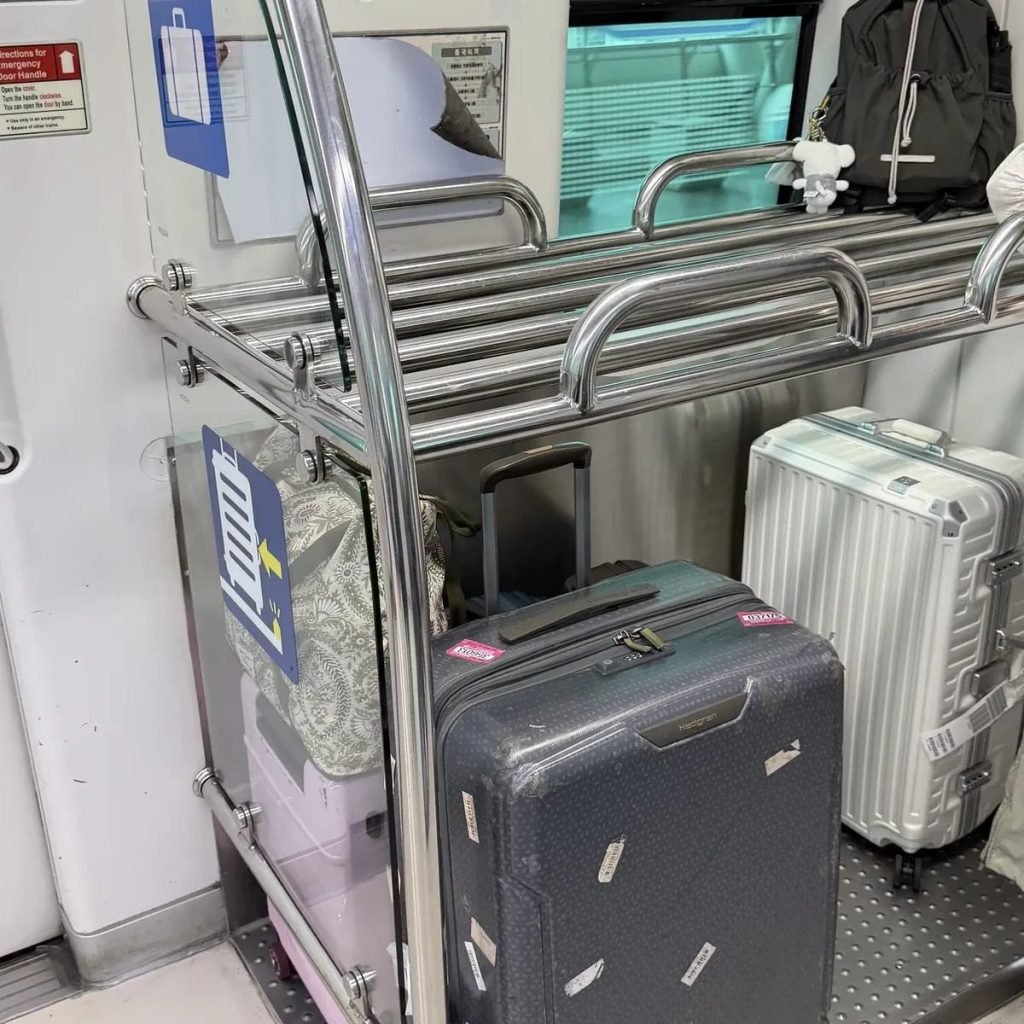 Dedicated luggage storage rack for suitcases inside a Seoul subway train
