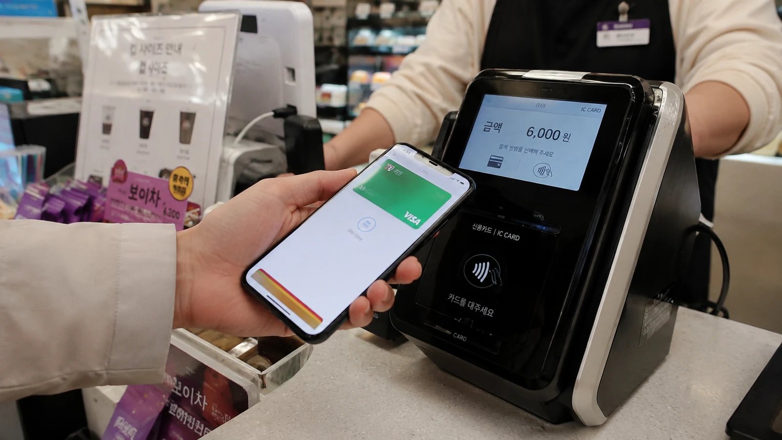 Paying with an iPhone at a contactless card terminal in Korea
