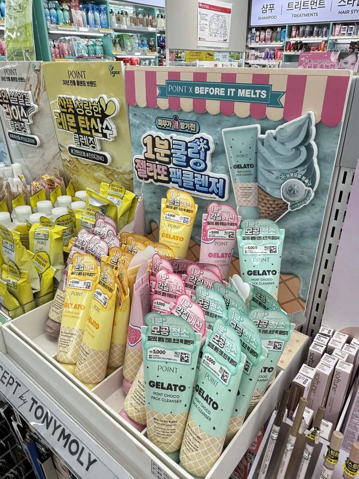 Affordable skincare products displayed on shelves at Daiso Korea.