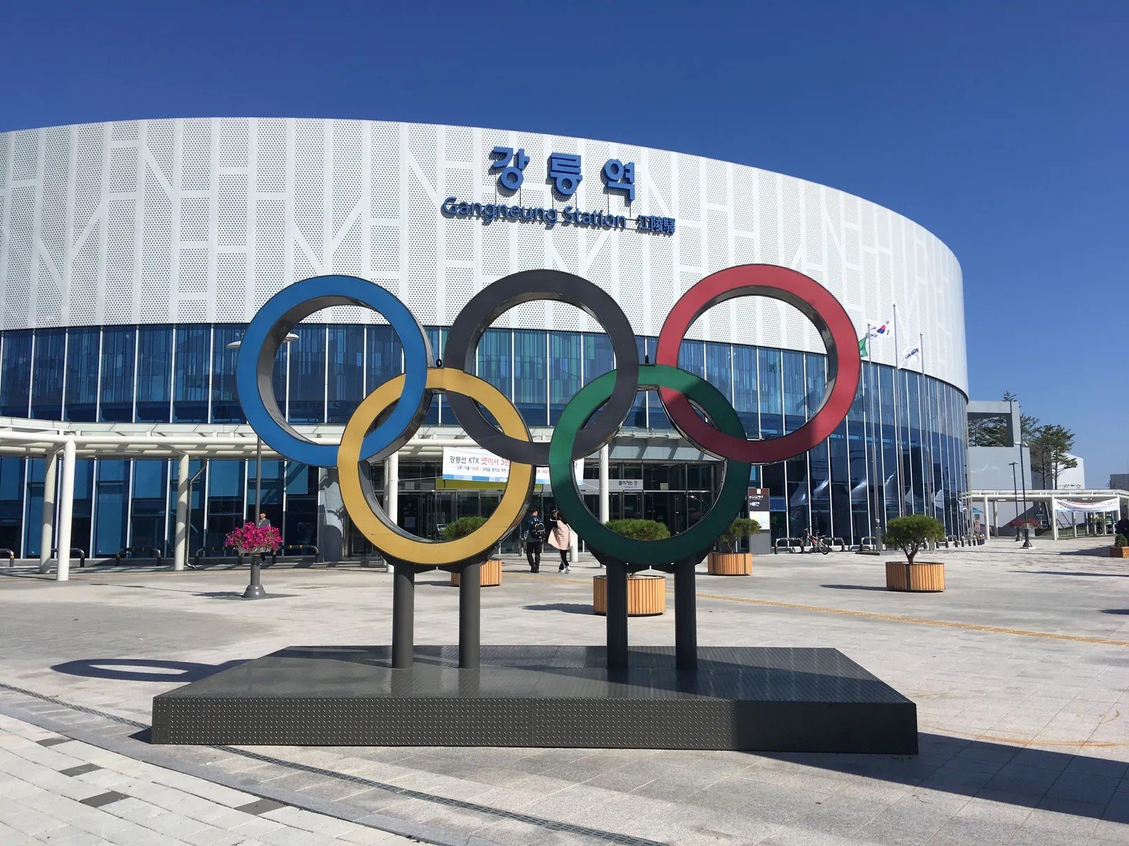 Gangneung Station exterior with an Olympic rings sculpture in front.