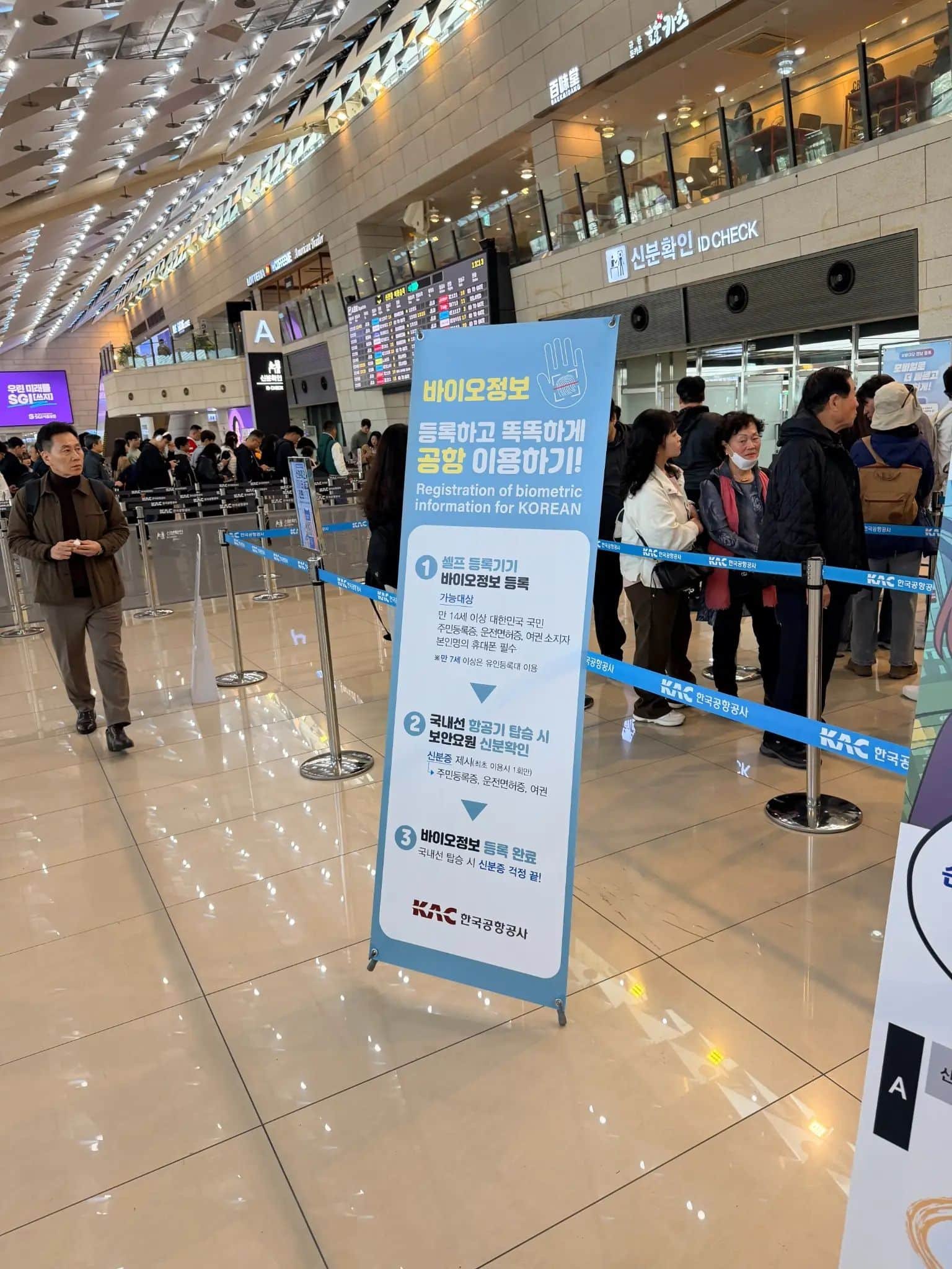 Travelers inside Gimpo Airport domestic terminal before flying from Seoul to Busan