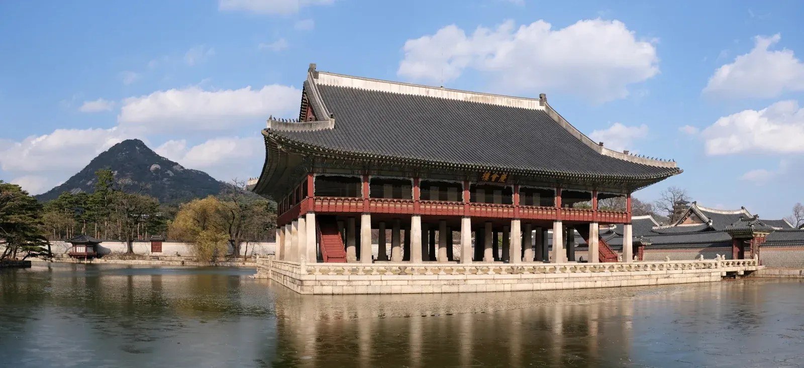 Gyeonghoeru Pavilion rises on stone columns beside its pond at Gyeongbokgung Palace.