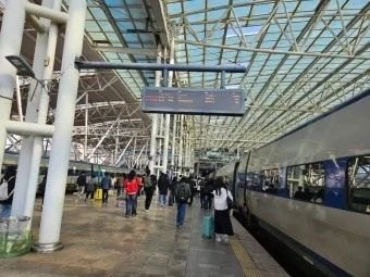 High-speed train platform in Korea with passengers preparing to board for an intercity trip