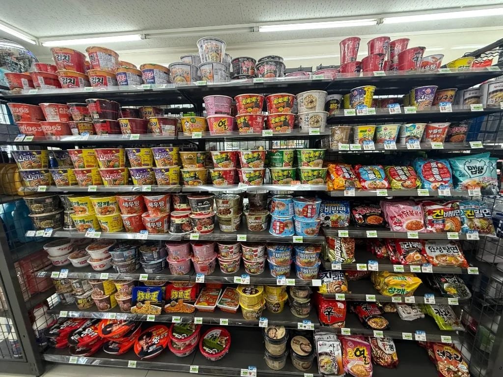 Cup noodles on shelves in a Korean convenience store