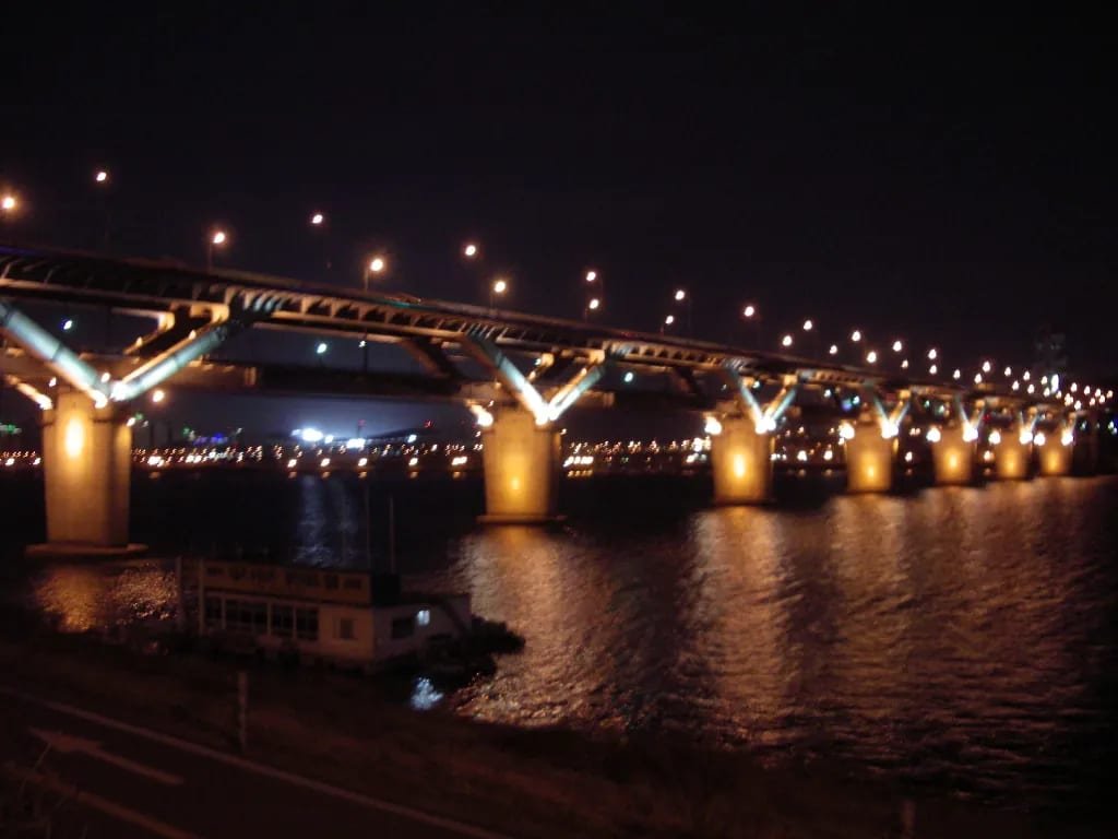 Cheongdam Bridge reflected in the Han River at night