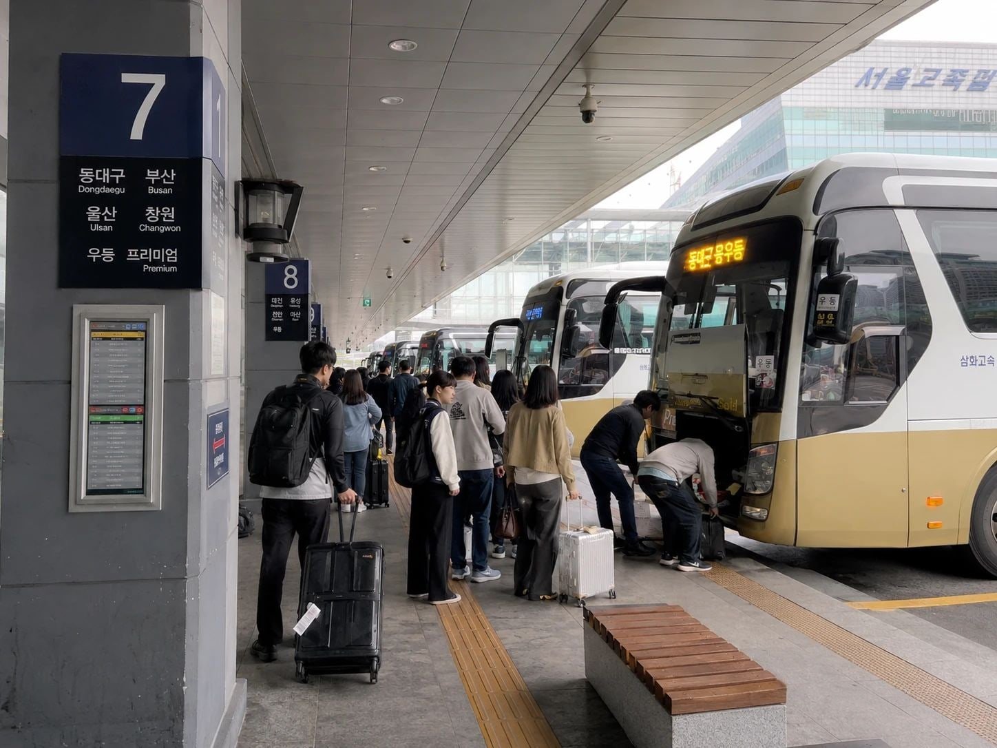 Travelers boarding express buses at Seoul Express Bus Terminal in South Korea